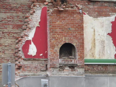 Demolished wall and fireplace